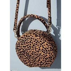 Circular leopard print crossbody bag